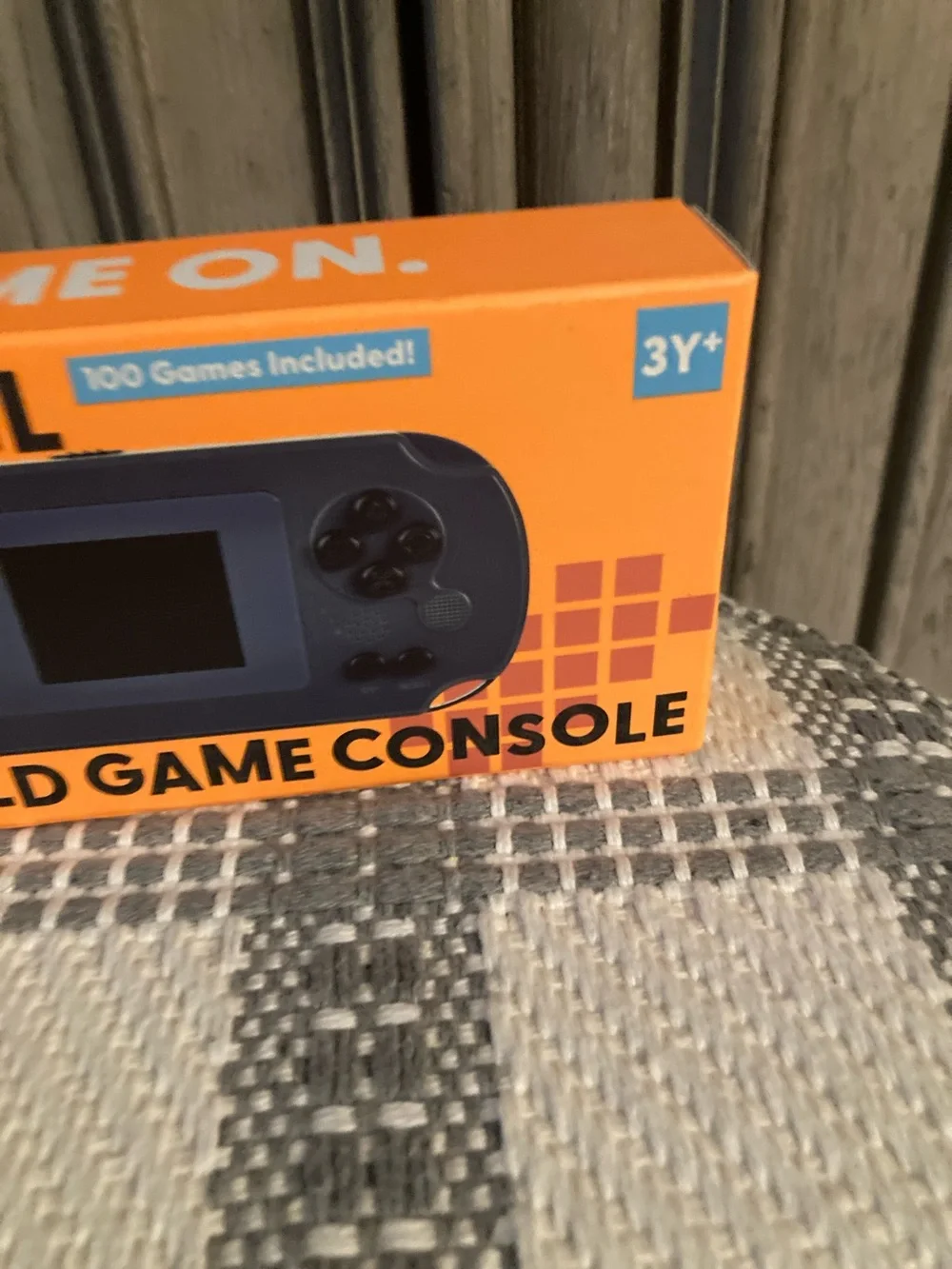 Next Level Apparel Handheld Game Console - Orange Box, Blue Device